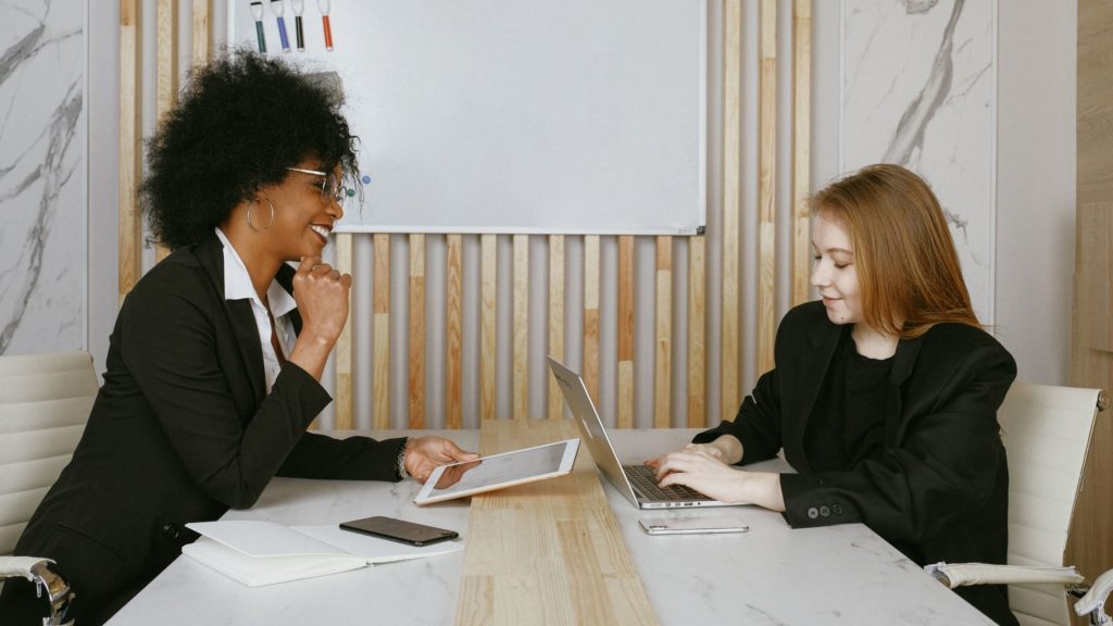 Giving Negative Feedback: A business woman gives constructive criticism to an employee